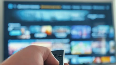 Man hand browsing smart tv apps,zapping channel,leisure lock down home lifestyle Stock Footage 162483542