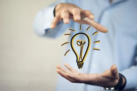 Man hand bulb Stock Photos