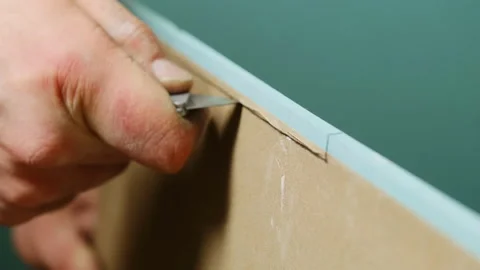 Man hand carefully cuts plasterboard panel with small knife 스톡 동영상 304407340