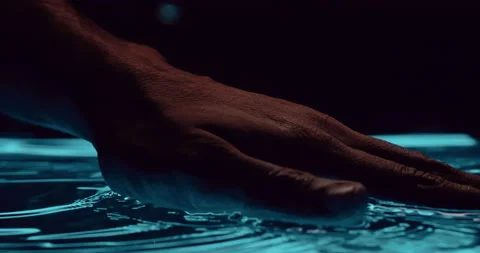 Man hand caressing water Stock Footage 202318654