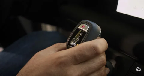 Man hand changes gear selector from Drive to Sport Stock-Footage 201214246