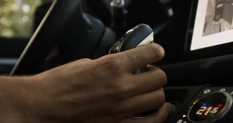 Man hand changes gear selector from Drive to Sport +1 Video stock 201216878