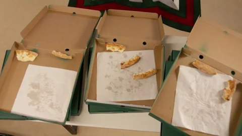 Man hand checks pizza boxes finding only crusts scattered inside Stock Footage 303105456