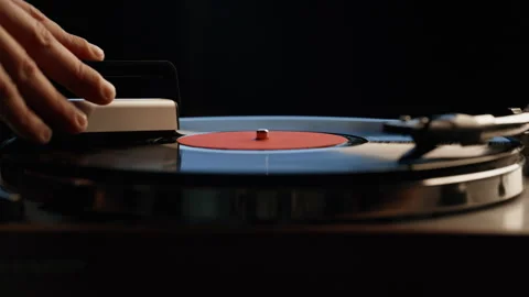 Man hand cleaning record playing on vintage turntable closeup. Macro vinyl disc Stock Footage 332616730