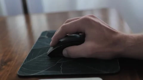 Man hand clicking buttons on pc mouse. Person thinking and working. Close Stock Footage 276827157