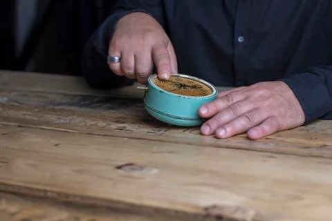 Man hand clock thinking age time wooden table vintage retro Stock Photos