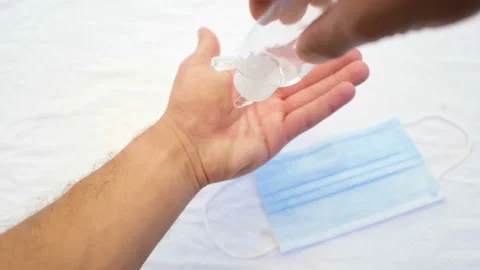 Man hand close up while disinfect with alchool hand sanitizer,covid19 disease 4k Stock Footage 136128825