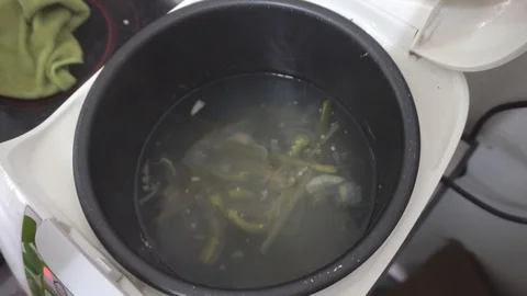 Man Hand Cook Seafood using Rice cooker Stock Footage 106791460