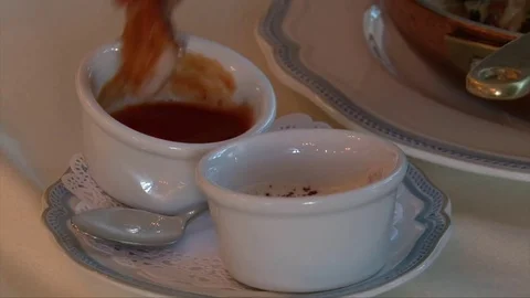 Man hand dipping peace of roasted chicken in sauceboat Stock-Footage 72302310