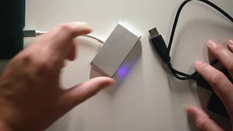 Man hand disconnect card reader Cable from Laptop, Storage top view Shot Stock Footage 169669612