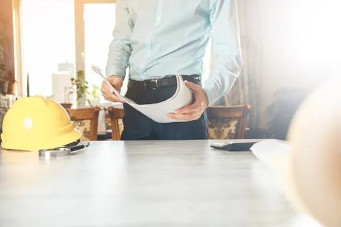.man hand document and calculator Stock Photos