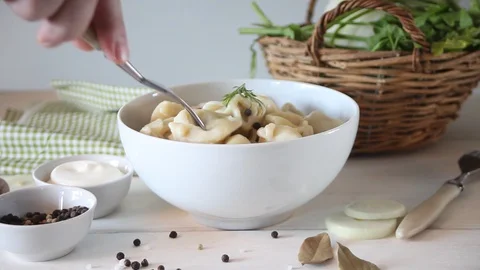 Man hand eat with fork russian pelmeni meat dumplings italian ravioli. Stock Footage 128414816