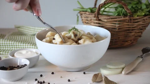 Man hand eat with fork russian pelmeni meat dumplings italian ravioli. Stock Footage 128414885