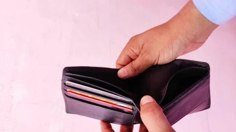 Man hand an empty wallet on light background 스톡 사진
