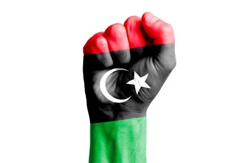 Man hand fist of LIBYA flag painted. Close-up. Stock Photos