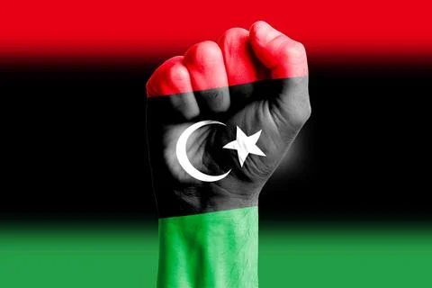 Man hand fist of LIBYA flag painted. Close-up. Stock Photos