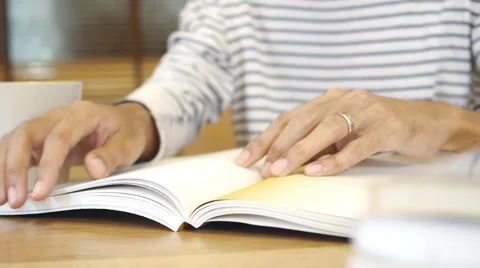 Man hand flip page of book and reading a book Stock Footage 65120898