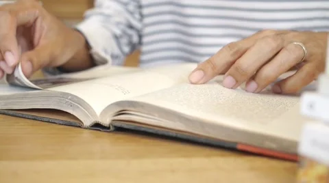 Man hand flip page of book and reading a book Stock Footage 65120924