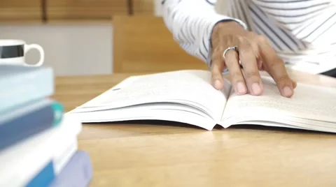 Man hand flip page of book and reading a book Stock Footage 65122145