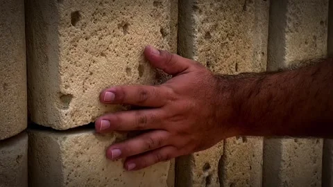 Man hand gently stroke surface, slide on stony wall of old building Vídeo Stock 279004826