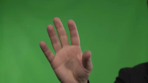 Man hand on green background Stock Footage 130144542
