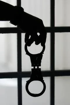 Man hand with handcuffs Stock Photos
