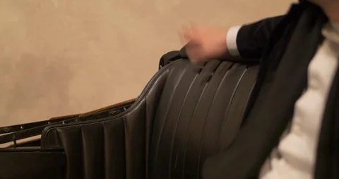 Man hand hitting the seat of old car Stock Footage 106529216