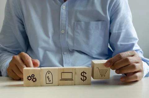 Man hand holding cube on table online shopping marketing icon business concep Stock Photos