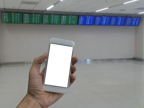 Man hand holding empty screen of smart phone and blur Flight Sch 库存照片