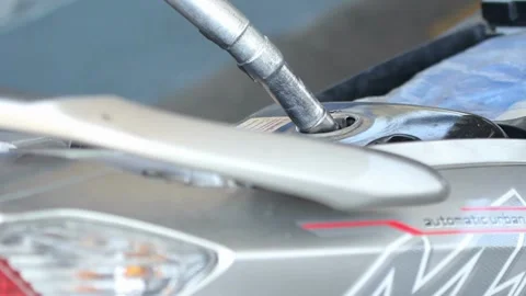 Man Hand Holding Gas Pump Handle and Filling the Fuel Tank on motorcycle 스톡 동영상 336569622