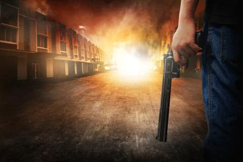 Man hand holding gun Stock Photos