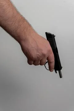 Man hand holding semi automatic pistol with locked back open slide Fotos Stock