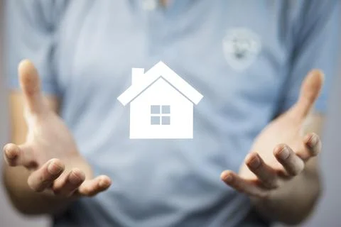 Man hand  house on  virtual screen Stock Photos