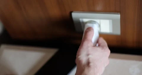Man hand inserting plug into socket at home closeup 4k movie slow motion Stock Footage 247049456