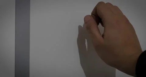 Man hand knocking on the door with his knuckles in a dark place Video stock 232316792