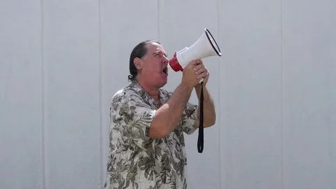 Man with hand loudspeaker shouting Stock Footage 75022219