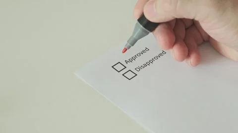 Man hand mark approved in checklist with red marker on paper blank 스톡 동영상 265880405