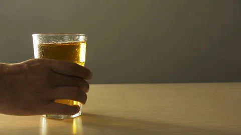 Man hand move full mug light beer on table closeup with condensation texture 4K. Stock Footage 116902006