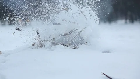 Man hand move out and something explode inside snowbank, wooden debris fly up Vídeos de archivo 84567692