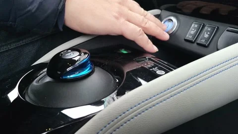 Man hand moving automatic transmission in parking position and Pushing Power OFF Stock Footage 220648825
