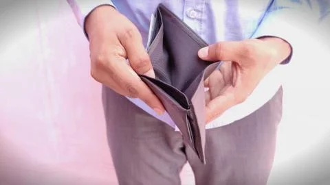 Man hand open an empty wallet on light background Stock Photos