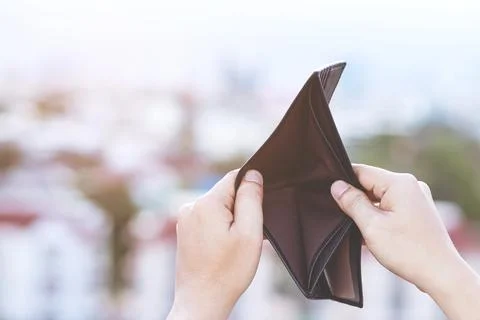 Man hand open an empty wallet isolated Stock Photos