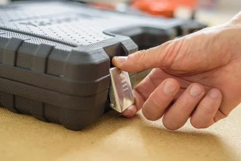 Man hand opening the case with tools. Do it yourself Stock Photos