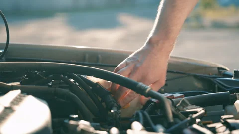Man Hand Opening Windshield Washer Fluid Reservoir Cap | Close-Up Car Engine Bay Stock Footage 339734020