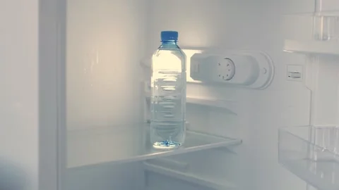 Man Hand Opens an Empty Fridge Door Looking Inside for Fresh Food and Drink. Stock Footage 311335912