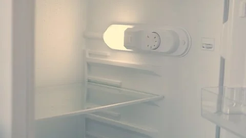 Man Hand Opens an Empty Fridge Door Looking Inside for Fresh Food and Drink. Stock Footage 321247206