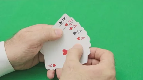 Man hand opens poker combination of three of kind aces and kings Video stock 265880071
