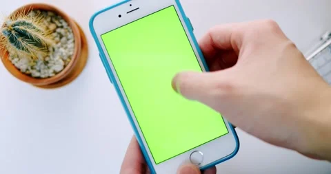 Man hand operating Green Screen iPhone (Touch, swipe and scroll) Video stock 147339678