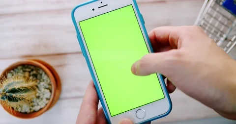 Man hand operating Green Screen iPhone (Touch, swipe and scroll) Video stock 147339708