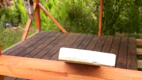 Man hand paints the side of the lining with a brush Stock Footage 76147829